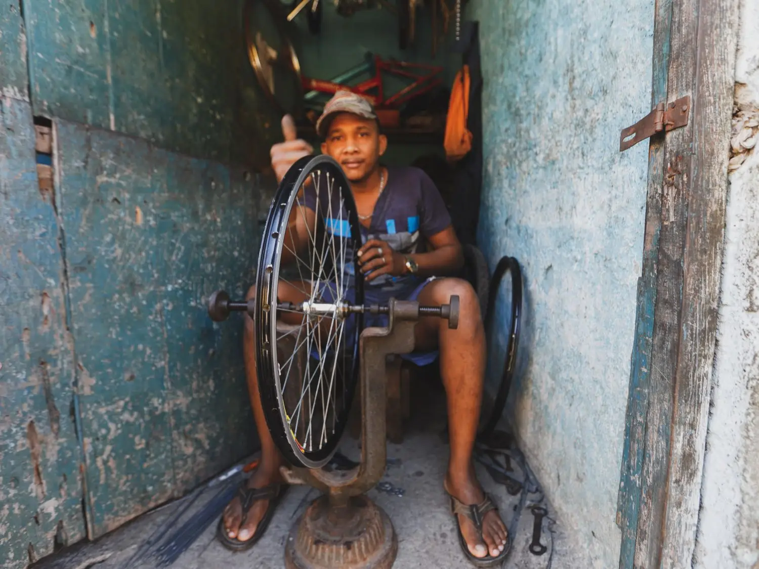 Bicycle mechanic checking a bike after service