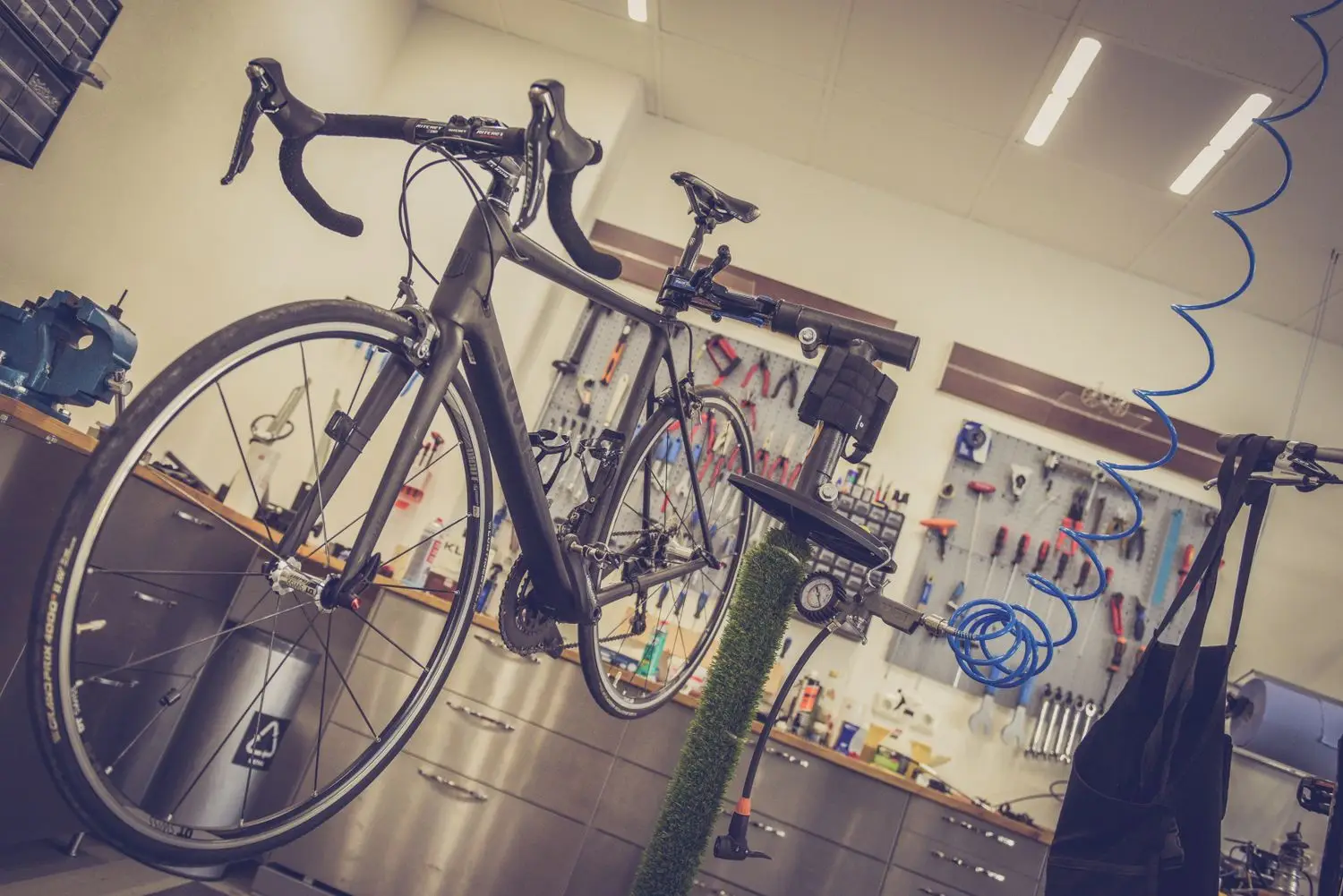 Bicycle repair workshop with bikes and service equipment