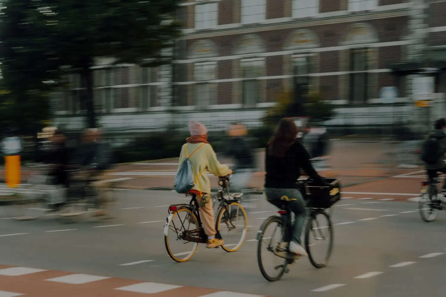 Cyclists riding through an urban neighbourhood
