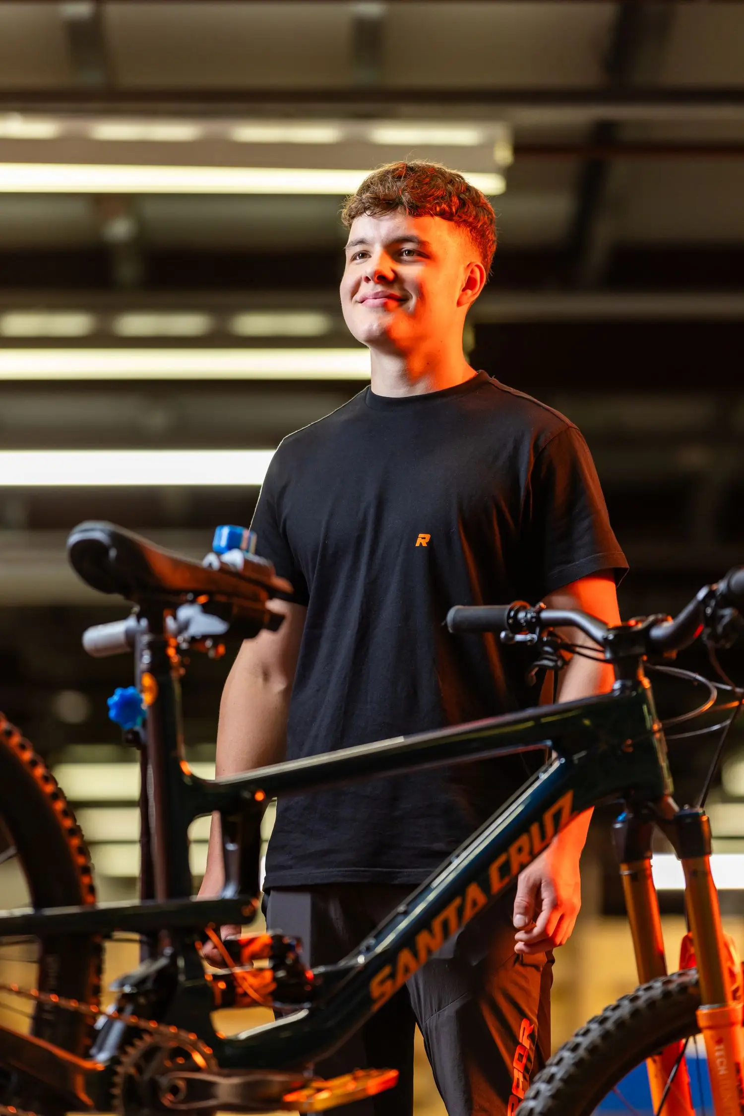 Bicycle workshop technician with a bike